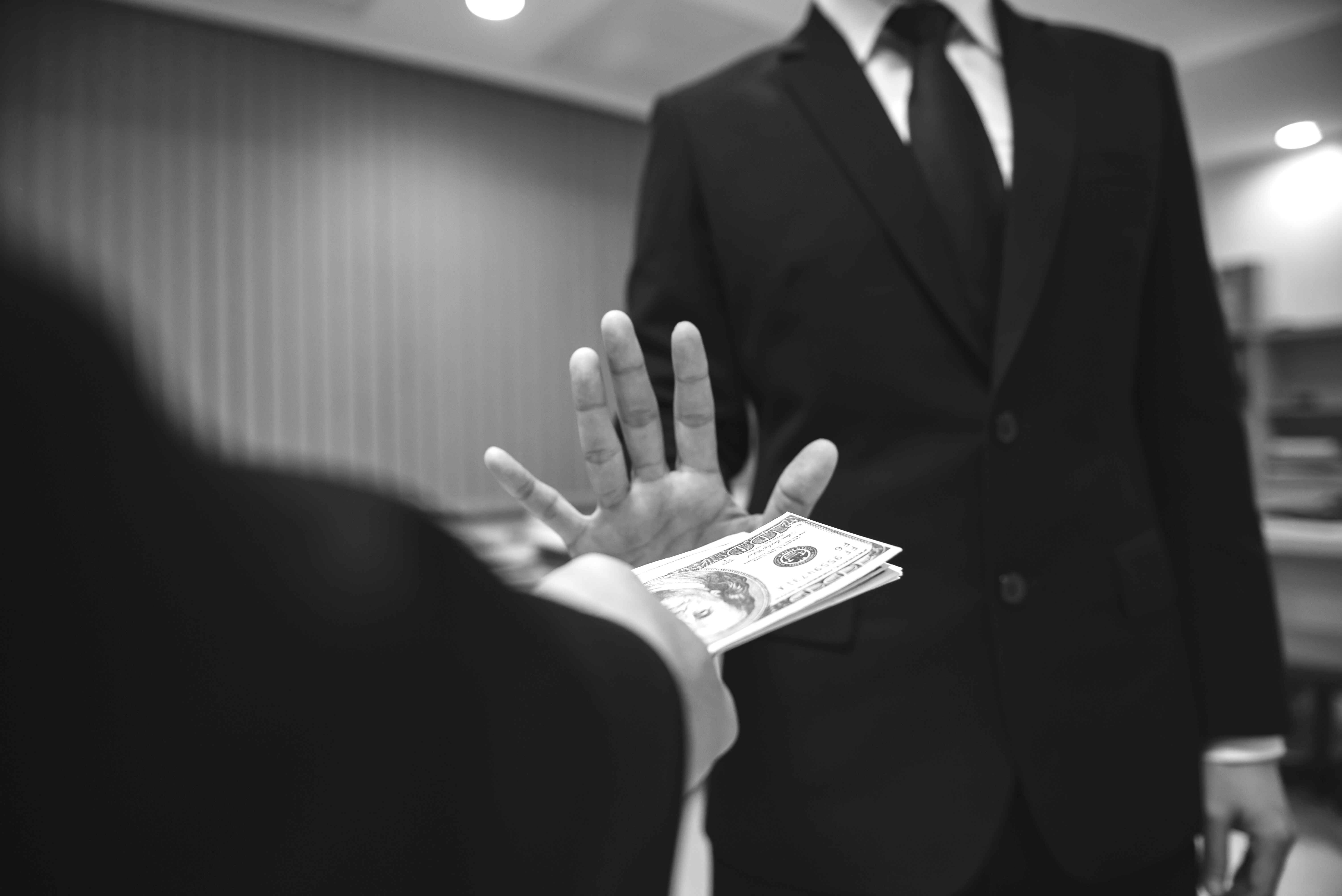 boss-gave-pay-bonuses-his-crewthe-two-businessmen-together-invest-businessno-corruption-conceptdo-get-dirty-money%20bw%20%281%29.jpg